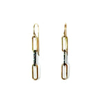 Gold chain earrings on a white background